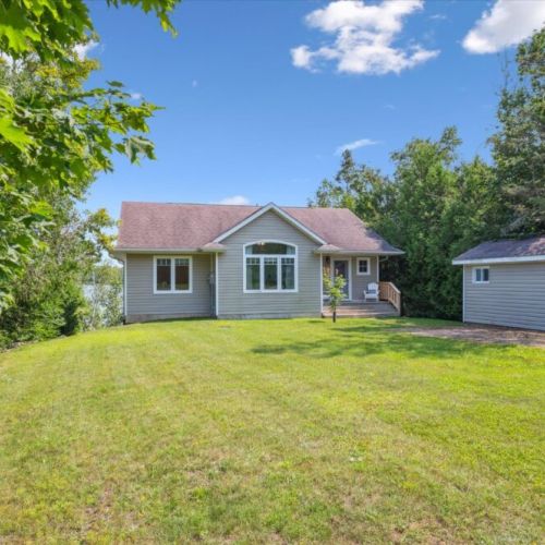 Expansive front lawn leading to the welcoming entrance — plenty of space for outdoor play and relaxation.
