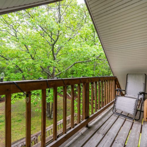 Enjoy the view of the surrounding property from the upstairs balcony.