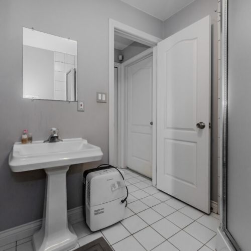 This bright, modern bathroom with a walk-in shower ensures comfort and convenience during your stay.