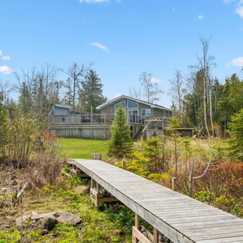 Private boardwalk connecting the cottage to the waterfront, offering scenic views along the way.