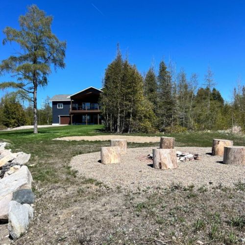 A view looking south to the main residence from the waterfront.