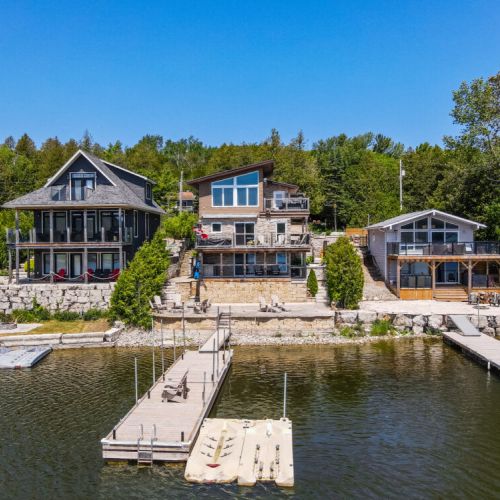 Full waterfront view of the cottage—multi-level living right on Georgian Bay.