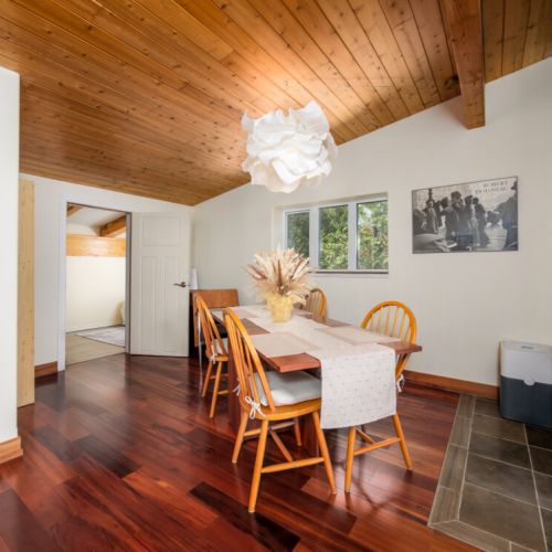 Gather around the dining table for meals, games, or conversation in this welcoming space.