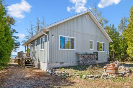 Surrounded by mature trees, the cottage offers a quiet and private setting to relax and enjoy everything the Bruce Peninsula has to offer.