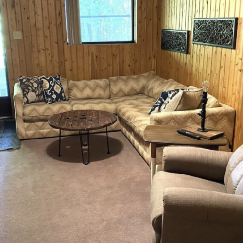 Sink into the plush sofas of the family room, a cozy den designed for shared laughter and storytelling, with the woodland just beyond the door.