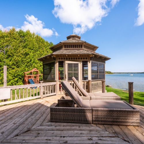 BBQ area and loungers along the deck to the enclosed gazebo.