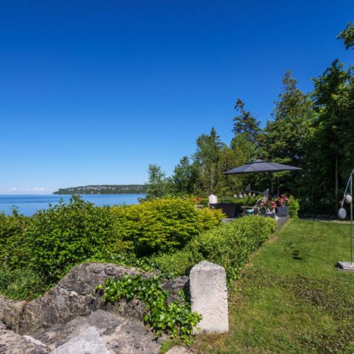 Beautiful landscaped grounds offer plenty of space to relax while enjoying stunning waterfront scenery.