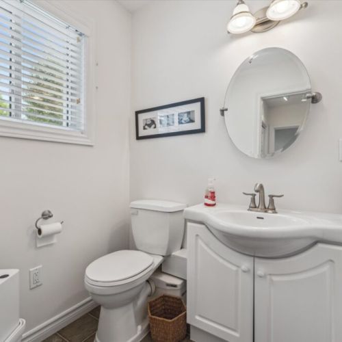 Main floor powder room – Fresh and convenient, located close to common areas for easy guest access, and separate entry from the master bedroom.