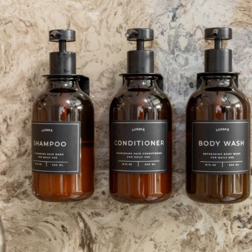 Shampoo, conditioner, and body wash are conveniently provided for guests during their stay.