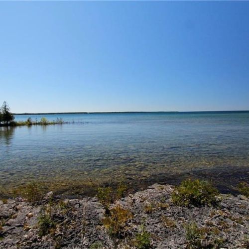 Natural stone shoreline with stunning open views across Lake Huron.