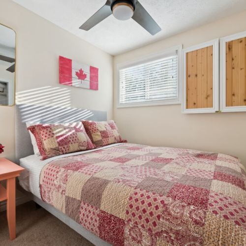 Bedroom 3: Comfortable bedroom with a warm, cottage feel and a relaxing place to recharge.