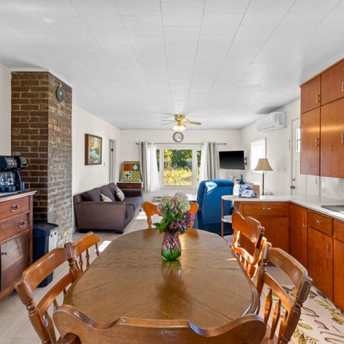The open kitchen, dining and living areas create a welcoming central space for your stay at Smith Homestead.