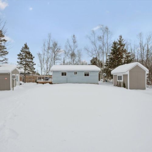 Large, open yard with bonus insulated bunkie — perfect for kids, extra guests, or a quiet escape.
