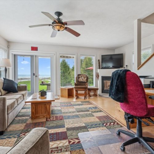 Bright, cozy, and open — the living room is your go-to space for relaxing with a book, movie, or just enjoying the lake view right outside the door.