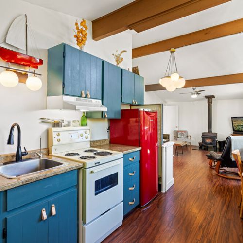 The open-concept kitchen flows seamlessly into the living area, making it easy to cook, gather, and relax together.