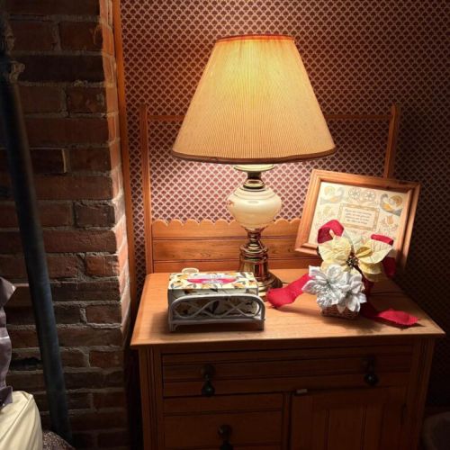 Sweet dreams and soft lamplight, a cozy bedside corner with a little Christmas sparkle