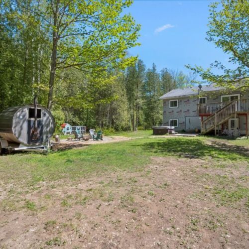 Spend evenings around the fire pit, relax in the sauna, and make lasting memories in the cottage's expansive outdoor recreation space.