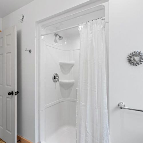 The full tub and shower combination is perfect for refreshing after a day outdoors.