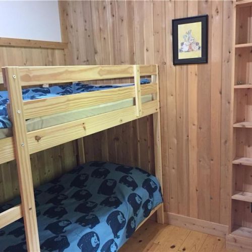 Bedroom 3: Additional bunk space offering flexible sleeping arrangements for larger groups.