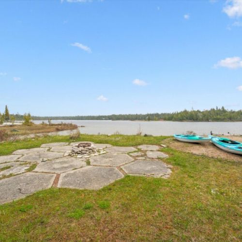 Explore the shoreline with convenient access to the water and complimentary kayaks ready for adventure.