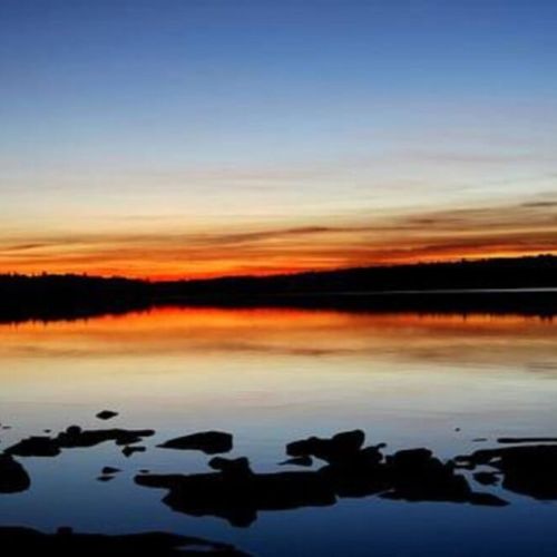 Witness unforgettable sunsets over the calm waters — the perfect end to a peaceful day at your cottage retreat.