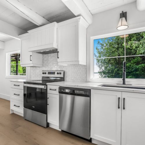 Bright kitchen with full size appliances and a great window view while you cook.