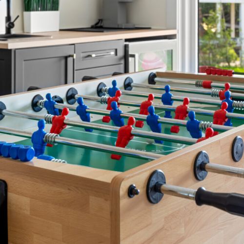 Enjoy hours of friendly competition with the home's foosball table.