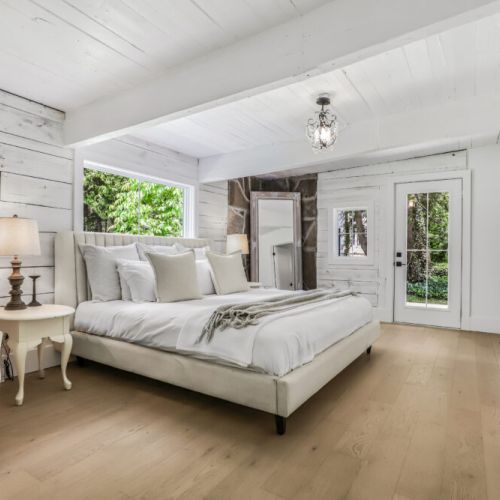 Spacious bedroom retreat with natural light and easy access to the outdoors.