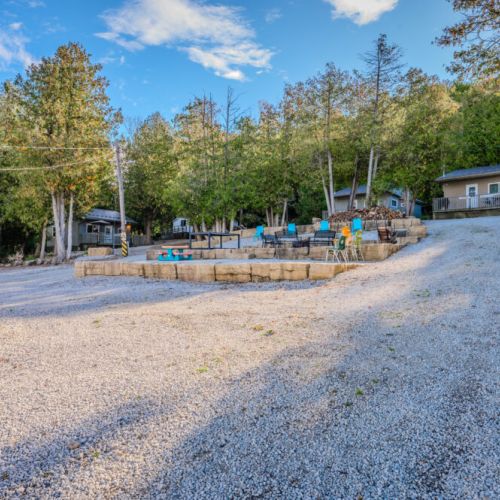 Spacious communal area with comfortable seating and tables, ideal for gathering with family and friends under the open sky.