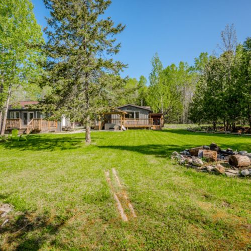 Embrace the great outdoors with a backyard designed for memories with a fire pit for storytelling, hammock for daydreams, and plenty of space for fun and games.