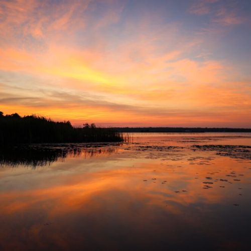 Unforgettable Stokes Bay sunsets that turn the water into a mirror of colour.