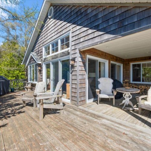 Soak up the sunshine on the spacious wraparound deck, offering plenty of room to relax, barbecue, and enjoy the peaceful surroundings.