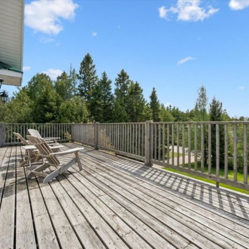 Expansive outdoor deck with plenty of space for relaxing in the sun.