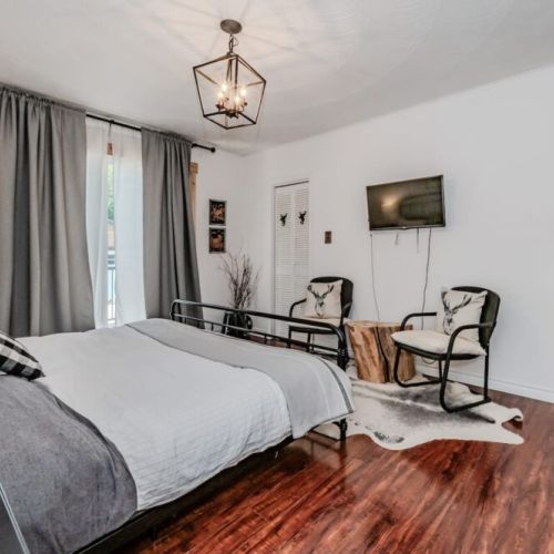 Step into the heart of the cottage from the Master bedroom, with direct access to the main hallway and shared spaces.