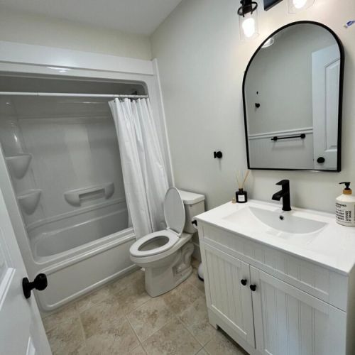 Enjoy a crisp, clean bathroom with sleek fixtures, full tub, and relaxing vibe—perfect for a post-hike refresh.