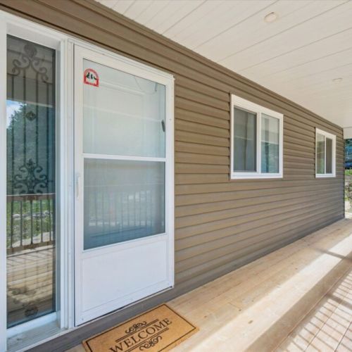 Step outside onto the expansive wraparound deck and enjoy fresh air, sunshine, and elevated water views.