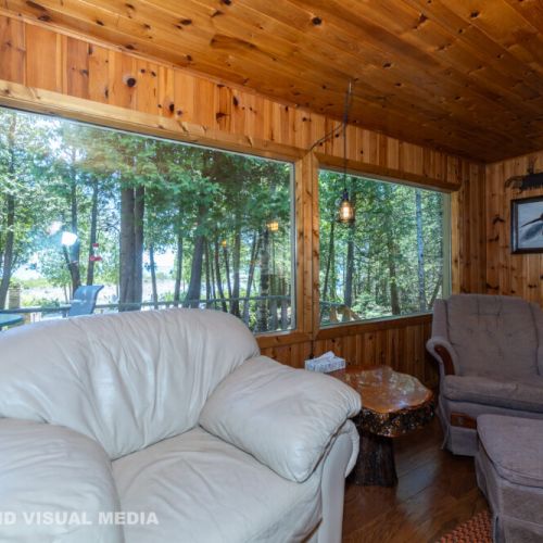 Curl up with a book and enjoy peaceful forest views from the cottage’s cozy reading nook.