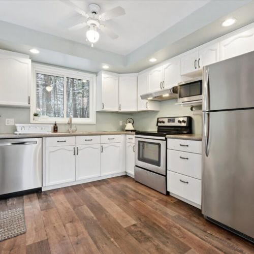 Fully equipped kitchen with stainless steel appliances and plenty of counter space
