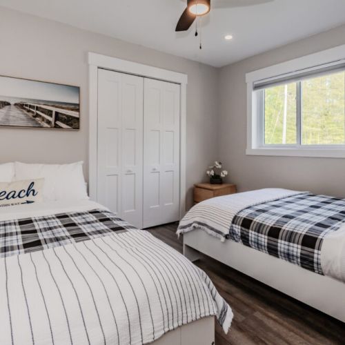 The main floor guest suite has 2 double beds and is perfect for the inlaws, kids or friends and family who need access to the main floor amenities.
