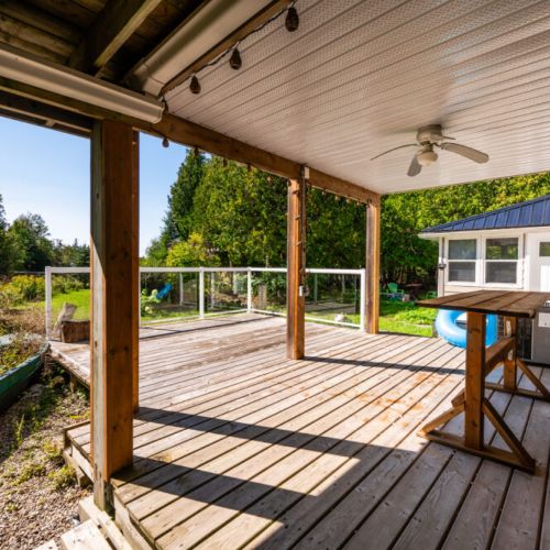 The back deck is spacious and well lit, perfect for an evening gathering.