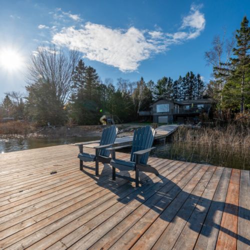 Wander towards the wooden dock and be welcomed by a tranquil escape. The dock extends over the water, providing a front-row seat to the serenity that surrounds you.