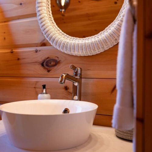 Modern finishes meet rustic charm—stylish sink area with thoughtful design.