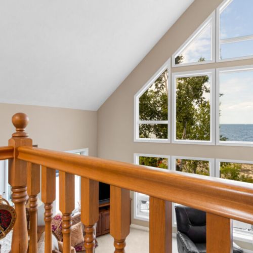 Even from the upper level, the soaring windows keep the beautiful Georgian Bay scenery front and centre.