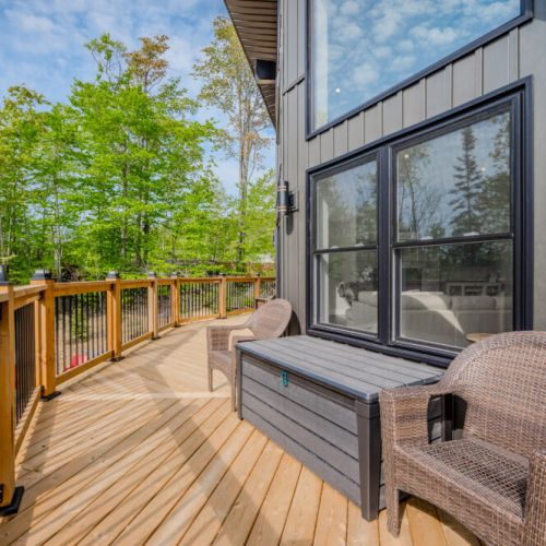 The deck features comfortable seating and a great view, ideal for relaxing and enjoying the fresh air.