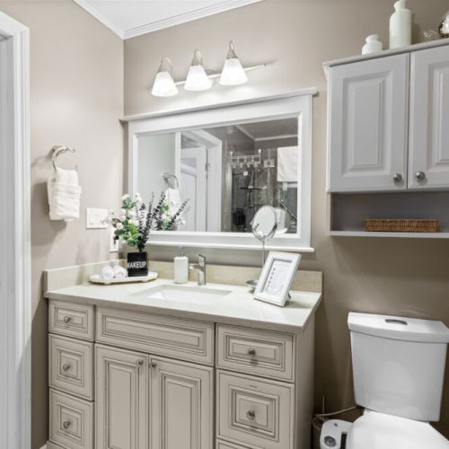 A spacious bathroom vanity offers plenty of counter space and storage, making it easy to get ready for the day.
