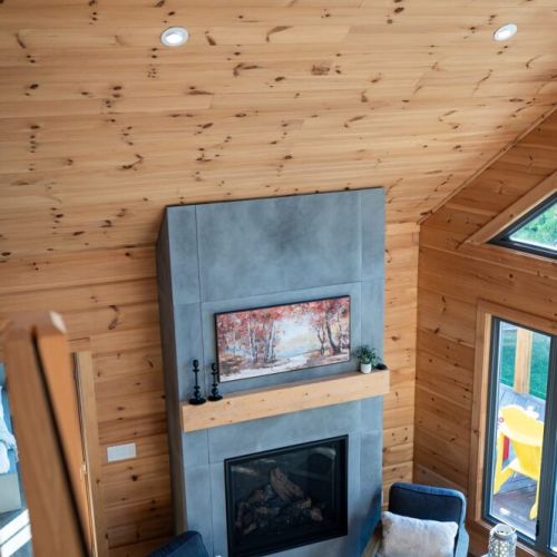 A cozy living space centered around a modern fireplace, perfect for evenings together.