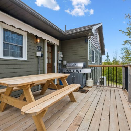 A full tank (propane) BBQ and picnic table for 6, conveniently located just outside the kitchen door.