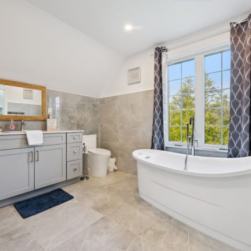 Spa-style bathroom with stand-alone soaker tub, perfect for relaxing after a day outdoors