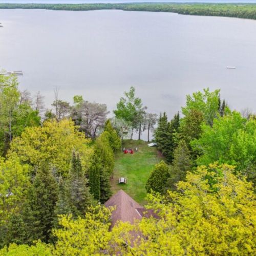From the tree canopy to the shoreline, this drone view highlights the stunning stretch of Cameron Lake’s calm, clean water.