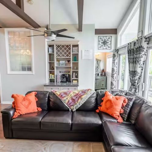 Stylish open-concept living area with vaulted ceilings and modern décor — perfect for gathering with family and friends.